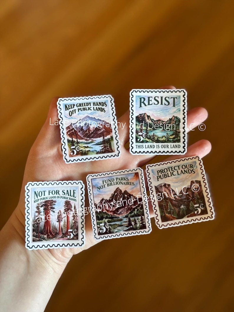 May include: A collection of five rectangular stickers resembling postage stamps. Each stamp features a landscape scene and text such as "Keep Greedy Hands Off Public Lands" and "Resist". The stamps have a serrated edge and a 5&cent; value.