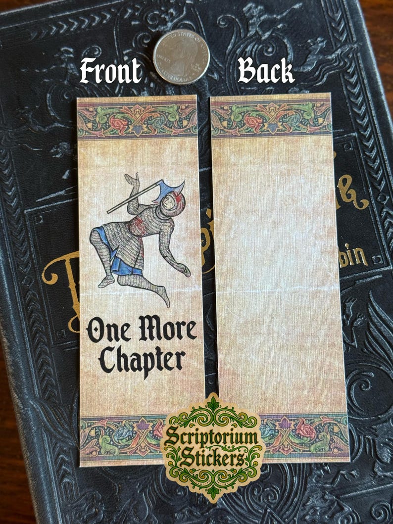 May include: Two medieval-themed bookmarks. The front bookmark features an illustration of a knight with an axe and the text "One More Chapter." The back bookmark is blank. The bookmarks have a decorative border with floral elements.