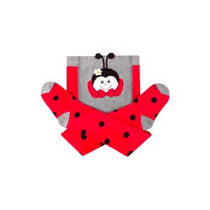 May include: Red and gray tights with a ladybug design. The ladybug has black eyes, a white flower, and a red bow.