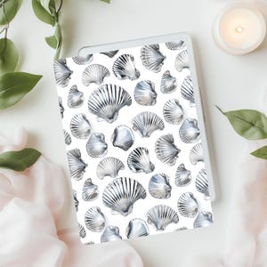 May include: A white background with a repeating pattern of silver seashells. The seashells are arranged in a staggered pattern, with some shells overlapping others.