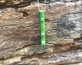 Green, enamel and copper pendant, with millefiori flower beads embedded ,bar pendant