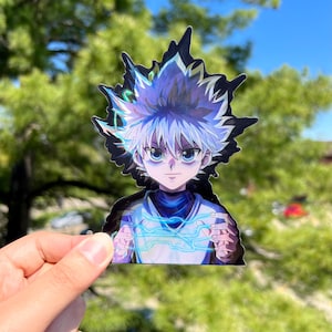 May include: A sticker featuring a cartoon character with spiky white hair, blue eyes, and a serious expression. The character is wearing a dark blue shirt and is holding a blue and white energy blast in their hands.