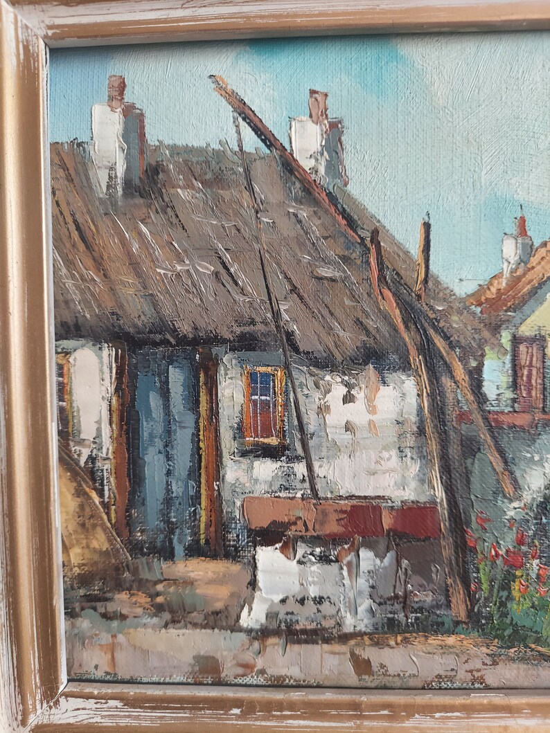 May include: A painting of a small, white cottage with a thatched roof. The cottage has a single window and a wooden door. The painting is done in a realistic style with a focus on the details of the building.