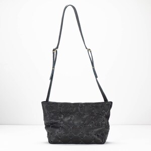 May include: A black leather shoulder bag with a quilted pattern and a gold-toned buckle.