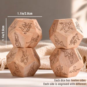 May include: Four wooden dice, each measuring 1.1 inches (2.8 cm) in height, are stacked. Each die has twelve sides, engraved with different patterns. The dice are light brown in color.