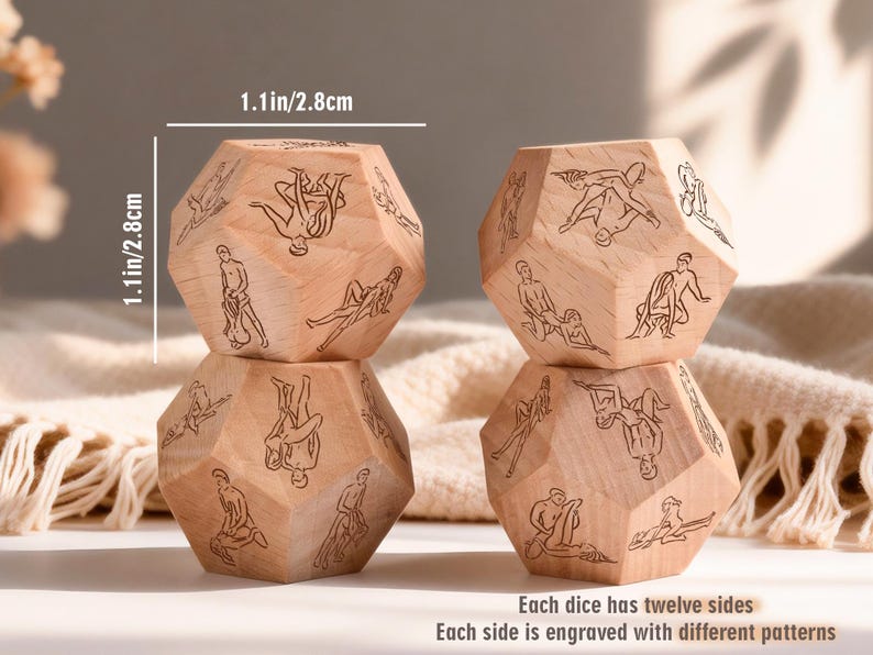 May include: Four wooden dice, each measuring 1.1 inches (2.8 cm) in height, are stacked. Each die has twelve sides, engraved with different patterns. The dice are light brown in color.
