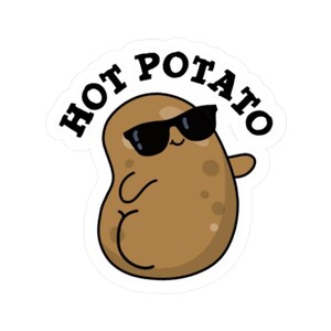May include: A die-cut sticker featuring a brown cartoon potato wearing black sunglasses. The potato has a small smile and is waving one arm. The text HOT POTATO is printed in bold black capital letters in an arc above the potato character.
