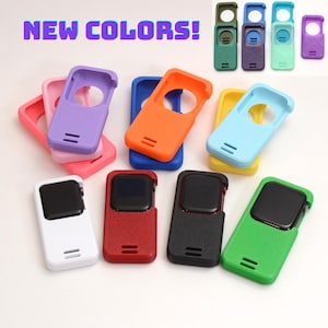 May include: A collection of rectangular silicone protective cases for smartwatches in various solid colors including white, red, black, green, orange, blue, yellow, light blue, pink, purple, and olive. The text NEW COLORS! is visible at the top.