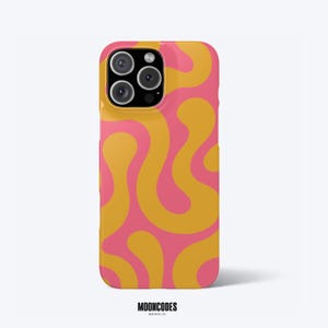 May include: A smartphone case featuring a repeating wavy, organic pattern in mustard yellow and bright pink. The case has a cutout for a triple-lens camera system on the back. Below the case, the text reads MOONCODES HOUSTON, TX.