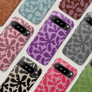 May include: A collection of colorful phone cases with a repeating abstract floral pattern. The cases are in various colors, including pink, purple, green, and gray. The cases are arranged in a diagonal pattern.