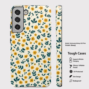 May include: A phone case for a Samsung Galaxy S22 Plus with a glossy finish. The case features a cream-colored background with a pattern of yellow flowers and dark green leaves. The side view of the case is also visible.