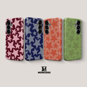 May include: Four phone cases with star patterns in burgundy, navy, coral, and olive green. Each case has a camera module. The brand logo "MOONCODES" is at the bottom.