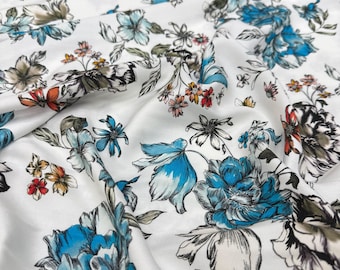 Tessuto in viscosa di cotone con stampa floreale bianca e blu – Materiale morbido e leggero / Larghezza 150 cm