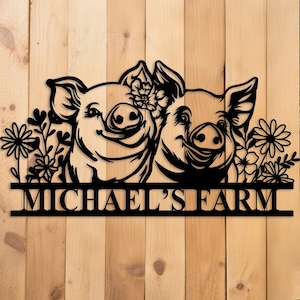 May include: Black metal sign featuring two smiling pigs with floral accents. The sign reads "MICHAEL'S FARM" in a bold, block font, perfect for farm decor. The sign is mounted on a wooden background.