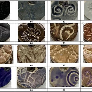 May include: A collection of ceramic pendants with various embossed designs and colors. The pendants are round with a hole at the top for hanging. Colors include black, blue, brown, and white. Each pendant has a unique pattern, such as swirls, floral, or abstract.