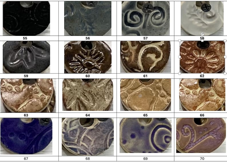 May include: A collection of ceramic pendants with various embossed designs and colors. The pendants are round with a hole at the top for hanging. Colors include black, blue, brown, and white. Each pendant has a unique pattern, such as swirls, floral, or abstract.