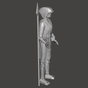 K&ouml;nnte beinhalten: Ein 3D-gedrucktes Modell einer Figur in Grau, die einen Helm tr&auml;gt und eine Lanze h&auml;lt. Die Figur steht mit leicht ge&ouml;ffneten Beinen und die Arme h&auml;ngen an den Seiten. Die Lanze wird in der rechten Hand der Figur gehalten.
