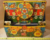 Rare Vintage Marx wind up, tin toy dart gun target, mechanical shooting gallery.