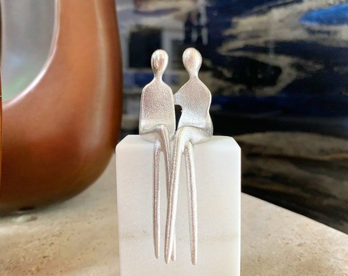 Sterling Silver Sisters or lesbian couple. Textured silver figurines mounted on Colorado marble.