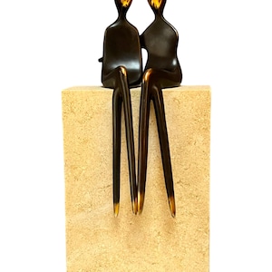 LGBTQ love two women sitting sculpture