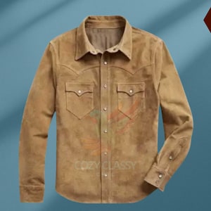 May include: A brown suede shirt with a button-down collar and long sleeves. The shirt has two chest pockets with button closures and a single button at the cuff of each sleeve.
