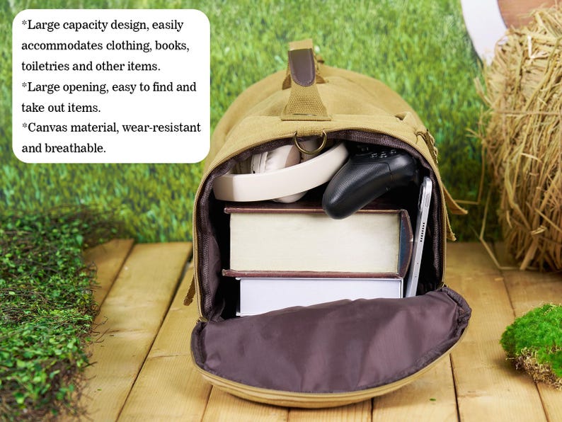 May include: A tan canvas duffel bag with a large opening and a brown interior. The bag is filled with books, headphones, and a video game controller. The bag is sitting on a wooden surface with green grass in the background. *Large capacity design, easily accommodates clothing, books, toiletries and other items. *Large opening, easy to find and take out items. *Canvas material, wear-resistant and breathable.