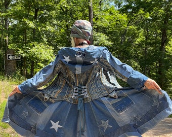 May include: A denim jacket with a star-studded design and a corset-style back. The jacket is made of multiple pieces of denim sewn together and features a white star on the back with the text "Feel The Energy".
