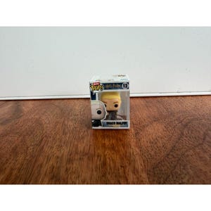 May include: A Funko Pop! vinyl figure of Draco Malfoy from the Harry Potter series. The figure has blonde hair and is in a clear plastic display case. The box features the Funko Pop! and Harry Potter logos.