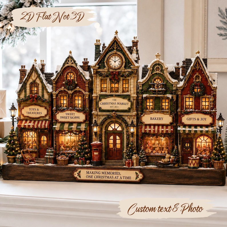 May include: A decorative Christmas village display featuring five connected buildings with illuminated windows, a central clock tower, and signs reading Toys & Treasures, Sweet Sweet Shoppe, The Christmas Market, Bakery, and Gifts & Joy, on a base.