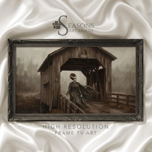 May include: A framed digital art print titled Seasons Art House High Resolution Frame TV Art, depicting a sepia-toned scene of a figure with an elaborate hairstyle and flowing cape standing inside a rustic wooden covered bridge in a misty forest.