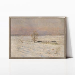 May include: A framed landscape painting showing a snow-covered field beneath a dusky sky. Bare trees and small buildings are visible in the distance. The artwork uses a muted colour palette of whites, greys, and pale pinks.