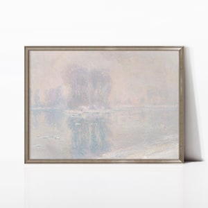 May include: A framed landscape painting with a muted color palette. The artwork depicts a misty river scene with soft blues, grays, and whites. The painting has a vintage aesthetic, with a silver-toned frame.