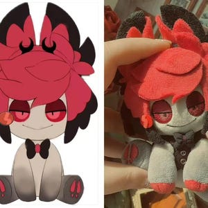 May include: A plush doll with a cartoon design. The doll has a red and black head with large, petal-like shapes, red eyes, and a small smile. It wears a black bow tie and a gray vest. The doll's body is primarily gray and white.