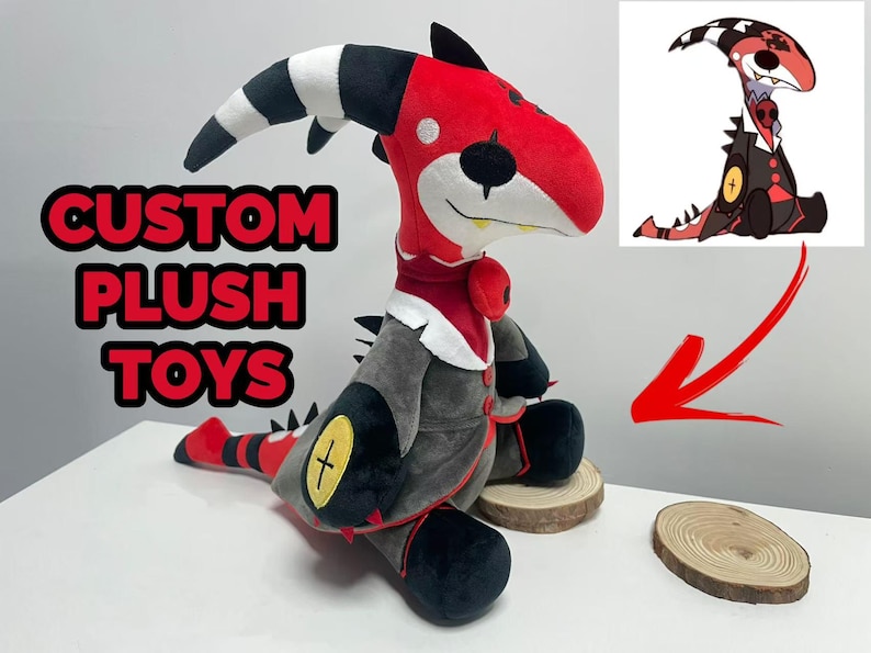 May include: A custom plush toy of a red and black dragon-like creature with a striped horn. The plush has a grey coat and black feet. The text "CUSTOM PLUSH TOYS" is displayed in red letters.