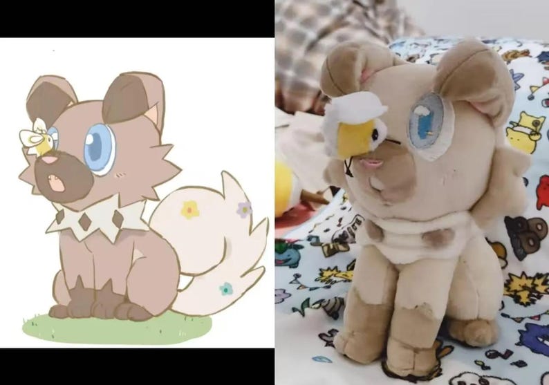 May include: A plush toy dog with light brown fur, blue eyes, and a white and tan collar. The dog has a bee attached to its face. The toy is sitting on a patterned blanket.