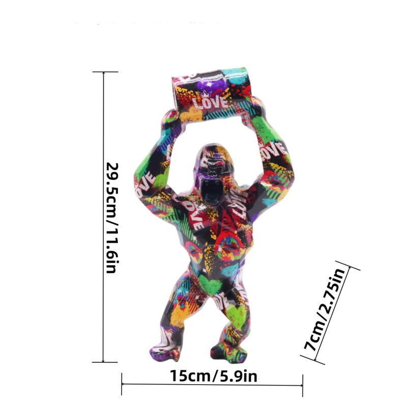 May include: A gorilla figurine featuring a vibrant graffiti-style pattern with the word LOVE printed repeatedly. The figure measures 11.6 inches in height, 5.9 inches in width, and 2.75 inches in depth, shown with visible dimension lines.