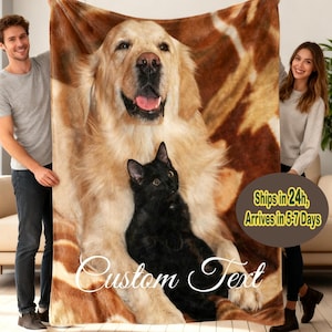 May include: A custom blanket featuring a golden retriever and a black cat. The blanket has a brown and tan background with the words "Custom Text" in a script font. The blanket is being held by two people.
