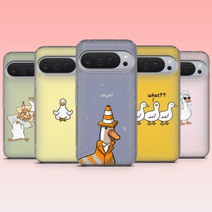 May include: Five phone cases with duck designs. The cases show different duck illustrations, such as a duck in a traffic cone with the text "safety duck", and ducks with the text "what??". The cases are in various colors, with a clear case.