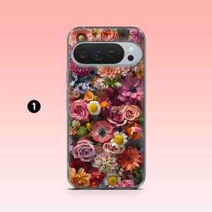 May include: A clear phone case with a colourful floral pattern. The case is adorned with a variety of flowers, such as roses, daisies, and dahlias, in shades of pink, orange, and purple. The phone's camera is visible at the top.