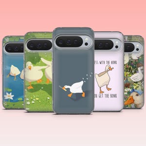 May include: A collection of phone cases with whimsical goose designs. Each case features a different illustration, including geese in various poses and settings, such as a pond and a field. The cases are in a variety of colors, including blue, green, and gray.
