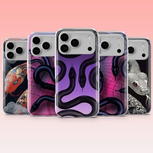 May include: Five clear phone cases featuring various snake illustrations. The designs include a red snake with blue eyes, black snakes on a purple background, a black snake on a pink grid, and a white snake with red eyes, all with camera cutouts.