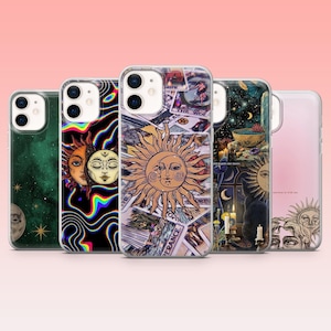 May include: A collection of five phone cases with celestial and mystical designs. The cases feature images of the sun, moon, stars, and tarot card illustrations. The cases are in various colors, including green, black, and pink.
