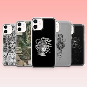 May include: Five smartphone cases arranged in a row, each featuring distinct black and white graphic designs of Medusa with snakes. The designs include collage-style imagery, minimalist line art, and detailed portraits on clear and black cases.