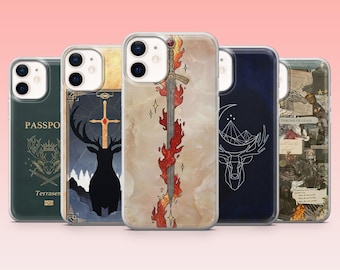 May include: A collection of five phone cases with various designs. The cases feature illustrations of a sword engulfed in flames, a deer with a cross, a deer with a crescent moon, and a passport. The cases are clear with a pink background.