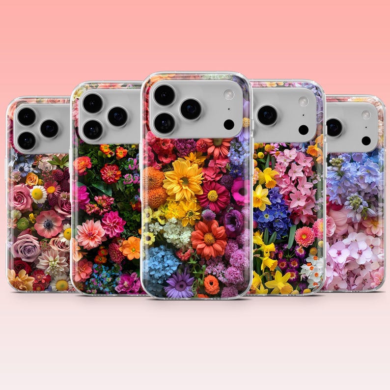 May include: Five clear phone cases with vibrant floral patterns. Each case displays a unique arrangement of flowers in shades of red, pink, yellow, orange, blue, and purple. The cases have a clear border and a camera cutout.