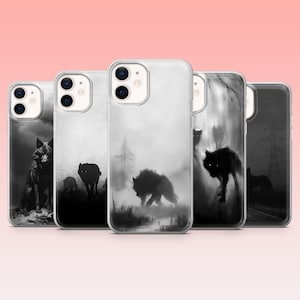 May include: A collection of five phone cases featuring a black and white wolf design. The artwork depicts wolves in a misty forest setting. The cases have a clear, protective outer shell.