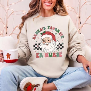 Santa's Favorite ER Krankenschwester Rundhals-Sweatshirt Weihnachten Notfall-Pullover ER Weihnachten Crew Er Krankenschwester Geschenk für Notfall Krankenschwester