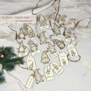 May include: Wooden gnome ornaments with name tags and ribbon. The gnomes are laser-cut with intricate details. Some tags have names like "Alex" and "Lisa", while others have holiday greetings. The text "svg Datei - Digitale Datei" is visible.