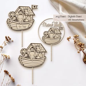 以下が含まれることがあります： 様々な動物が描かれたノアの箱舟の木製ケーキトッパー。トッパーにはライオン、サル、ゾウ、キリン、サイが含まれています。1つのトッパーには「Zur Taufe」という文字があり、もう1つには「Meine Taufe」という文字があります。