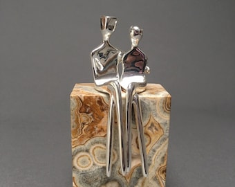 Silver Caress | Silver-Plated Sculpture of a Loving Couple | Silver Anniversary Present | Natural Travertine Stone Base | By Yenny Cocq